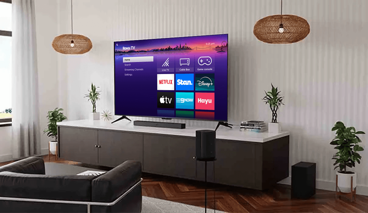 Family in living room watching Roku TV