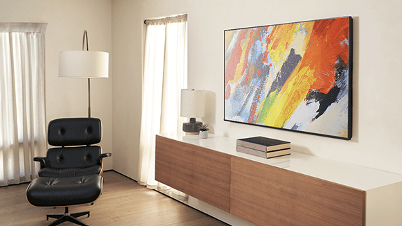 Angled view of the Roku Pro Series TV mounted on a wall