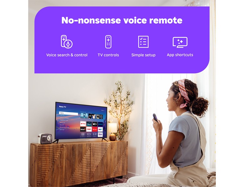 Person using the Roku Voice Remote to control their Roku TV