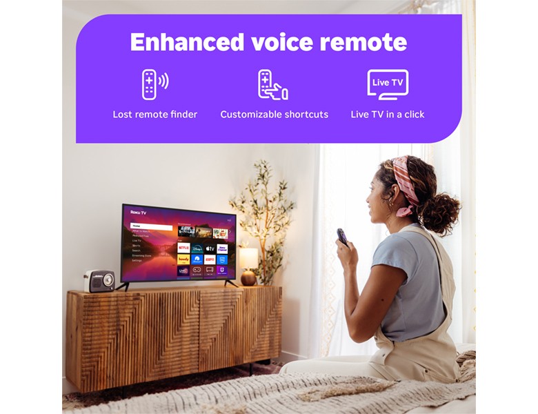Person using the Roku Enhanced Voice Remote to control their Roku Plus Series Mini-LED TV