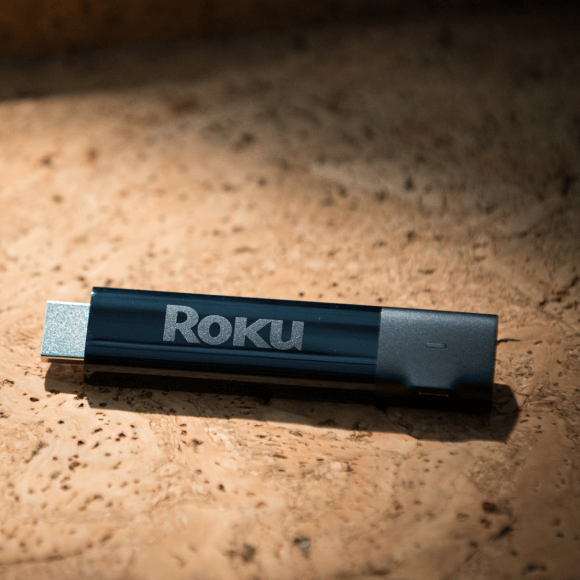 Upclose shot of a person holding a Roku® Streaming Stick®+