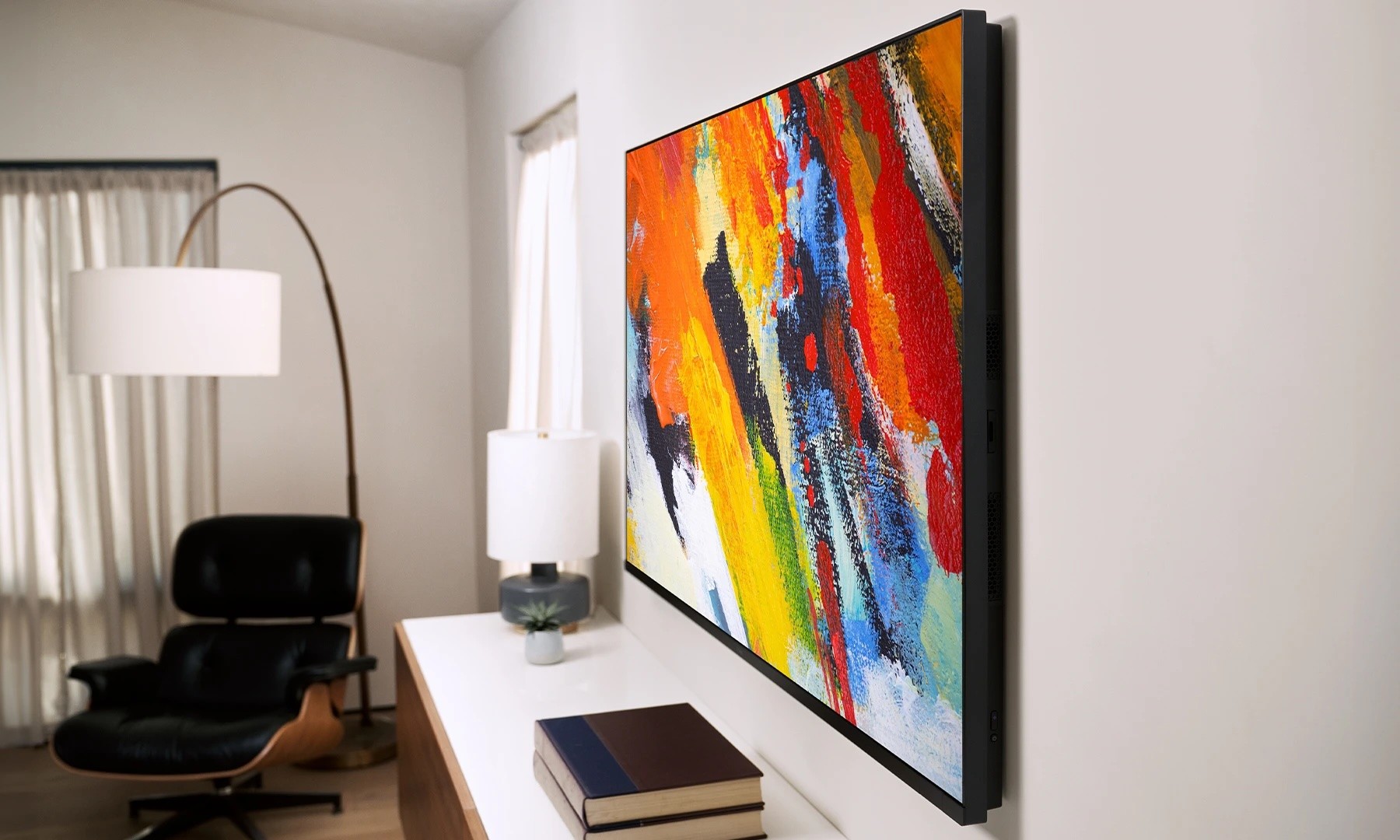 Side view of the Roku Pro Series 4K Mini-LED TV mounted on a wall