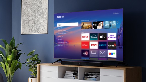 Roku Select Series TV and Roku TV Wireless Soundbar on a credenza
