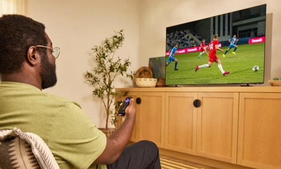 Side view of the Roku Pro Series 4K Mini-LED TV mounted on a wall