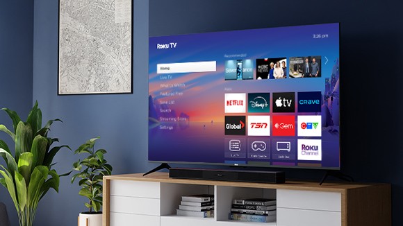 Roku Select Series TV and Roku TV Wireless Soundbar on a credenza