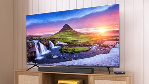 Roku Plus Series Mini-LED TV displaying a colorful QLED screen