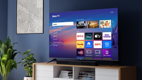 Roku Select Series TV and Roku TV Wireless Soundbar on a credenza