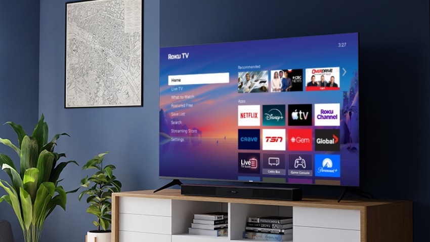 Roku Select Series 4K TV and Roku TV Wireless Soundbar on a credenza