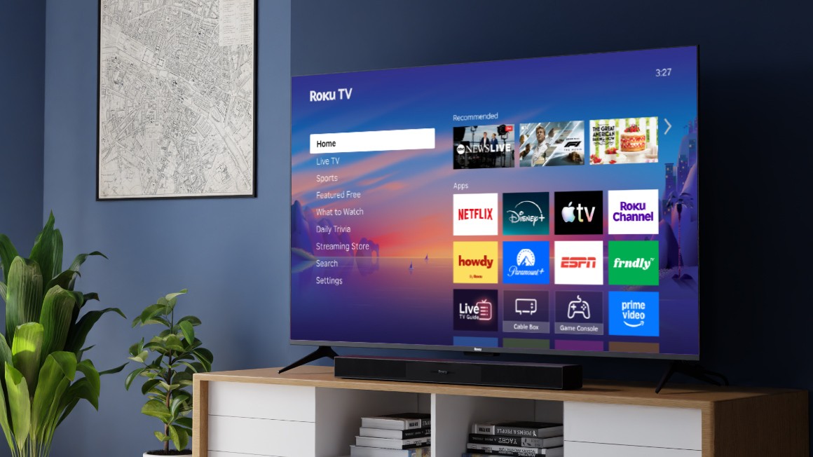 Roku Select Series 4K TV and Roku TV Wireless Soundbar on a credenza